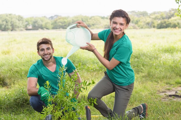 Photo happy friends gardening for the community