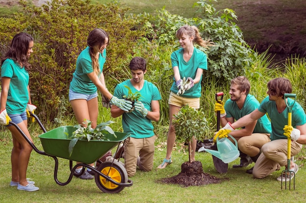 Happy friends gardening for the community