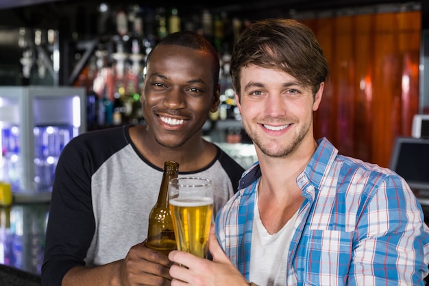 Happy friends having a drink