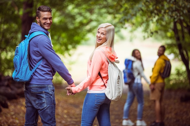 Happy friends on hike together in the countryside