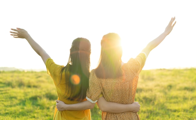 Happy friends holding each other