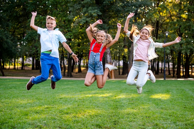 Happy friends jumping together 