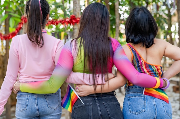 Happy friends LGBTQ transgender Asian woman LGBTQIA holding each other in summer party friendship concept