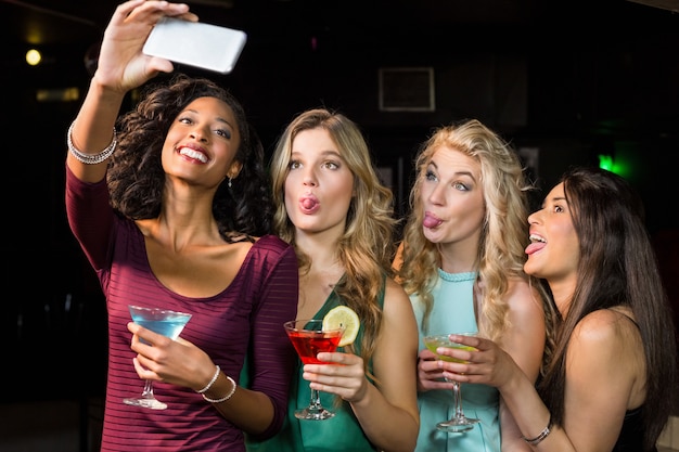 Happy friends taking a selfie