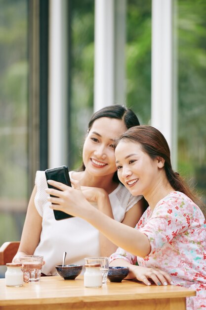 Happy friends taking selfie