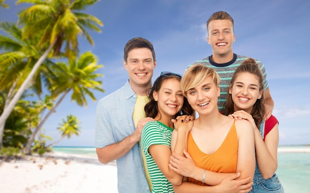 happy friends over tropical beach background