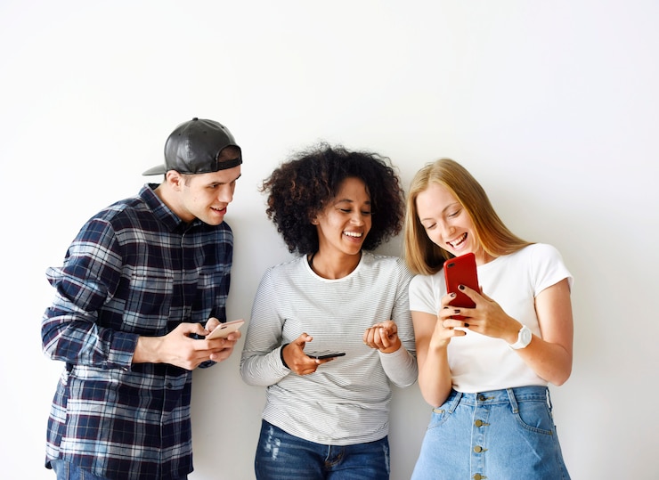 Photo happy friends using smartphone together social media concept
