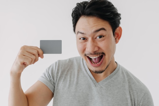 Happy funny face man show off his empty card on white background