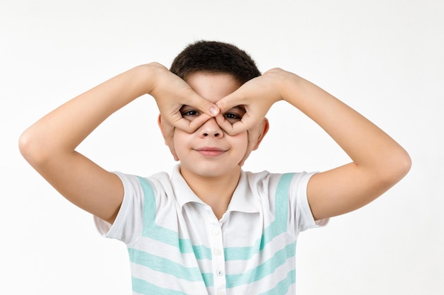 happy funny little child boy in striped tshirt having fun