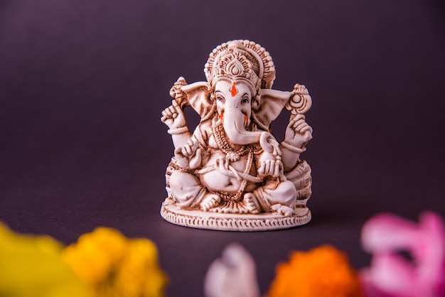 Happy Ganesh Chaturthi greeting card using photograph of Lord ganapati Idol or Elephand god of Hindu religion