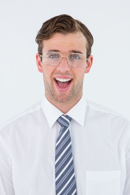 Happy geeky businessman looking at camera 