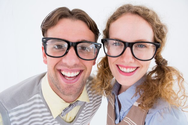 Photo happy geeky hipster smiling at camera