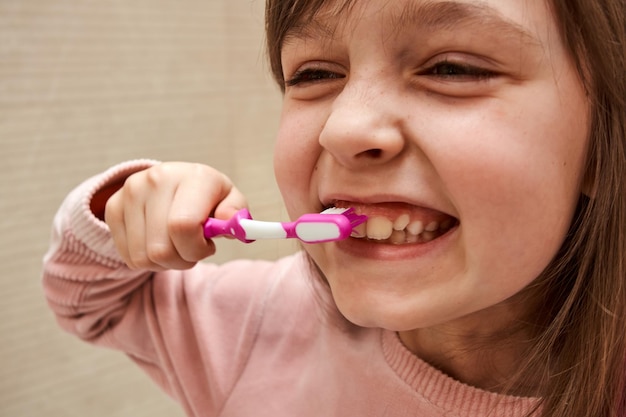 Photo happy girl brushing her teeth daily ritual of brushing teeth