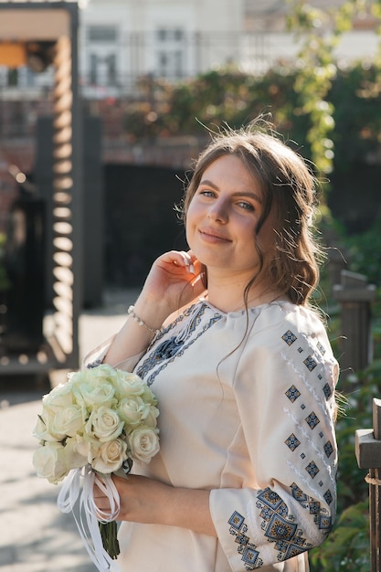 happy girl in an embroidered shirt