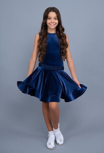 Happy girl face positive and smiling emotions Full length of teenager child girl wearing ball dress