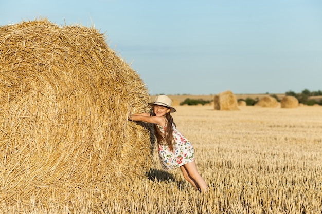 Happy girl on field of wheat