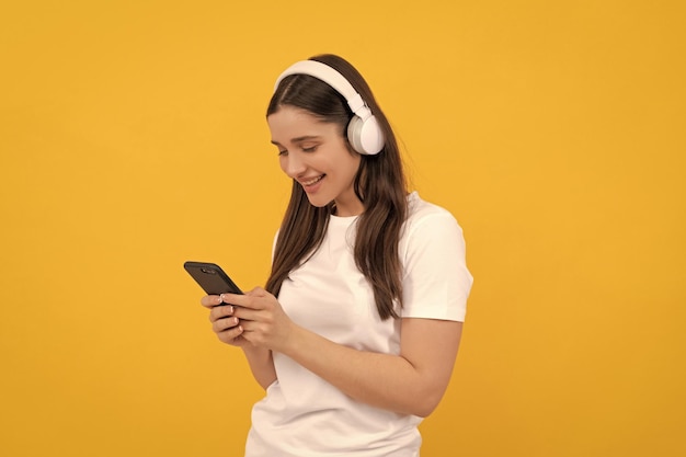 Happy girl in headphones webinar in wireless headset modern education online