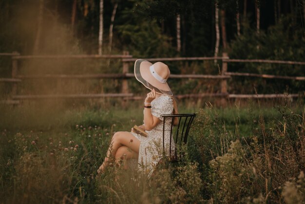 Happy girl Long hair White dress A hat with a brim