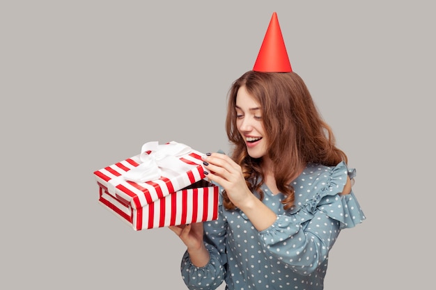 happy girl       opening gift box peeking what bonus inside smiling enjoying birthday present