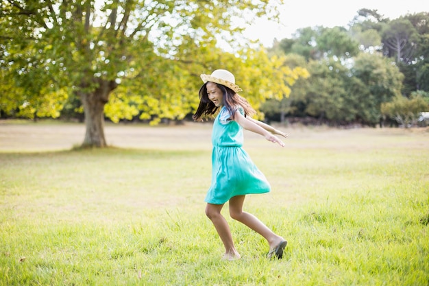 Happy girl playing in park