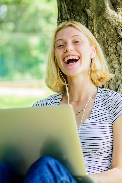 Happy girl Relax in park modern woman with computer outdoor girl work on laptop Pretty woman smiling summer online Morning chart Confident at her researches happy to be there