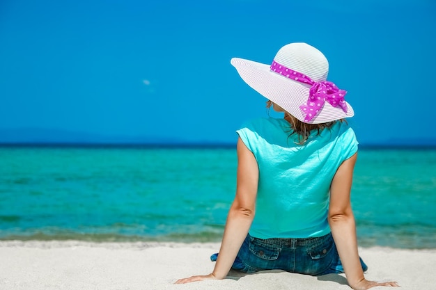 Happy girl at sea in greece on sand nature