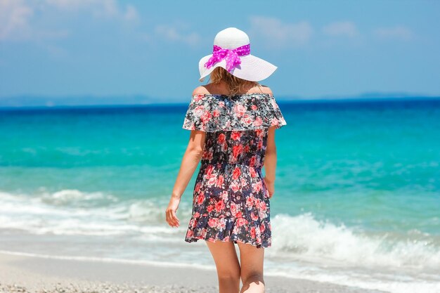 A Happy girl on the shore of the sea in travel vacation