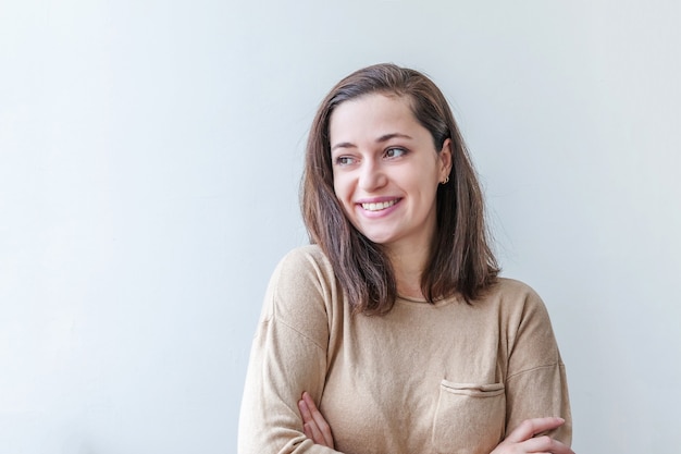 Happy girl smiling. Beauty portrait young happy positive brunette woman isolated on white background.