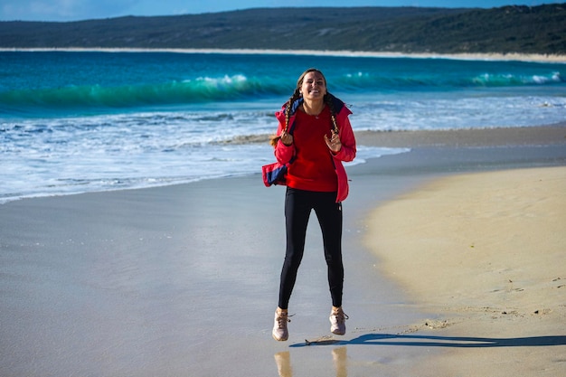 happy girl walks on famous stingray beach in hamelin bay, near margaret river in western australia