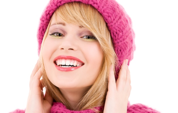 happy girl in winter hat over white