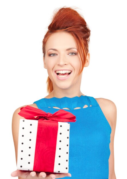 happy girl with gift box over white