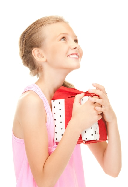 happy girl with gift box over white