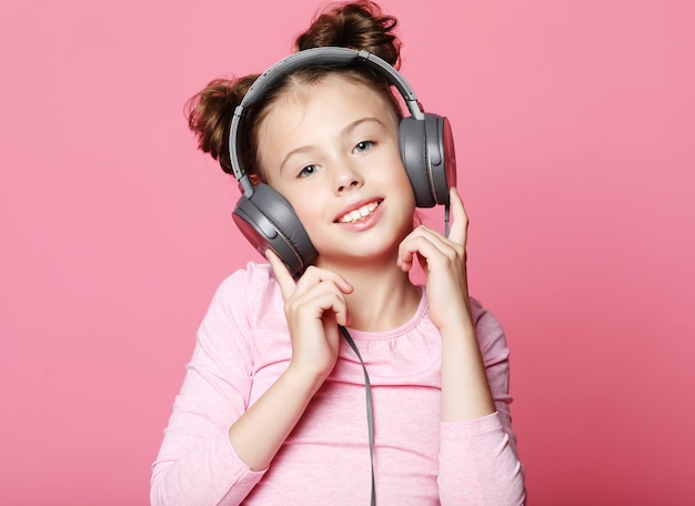 Happy girl with headphones listening to music