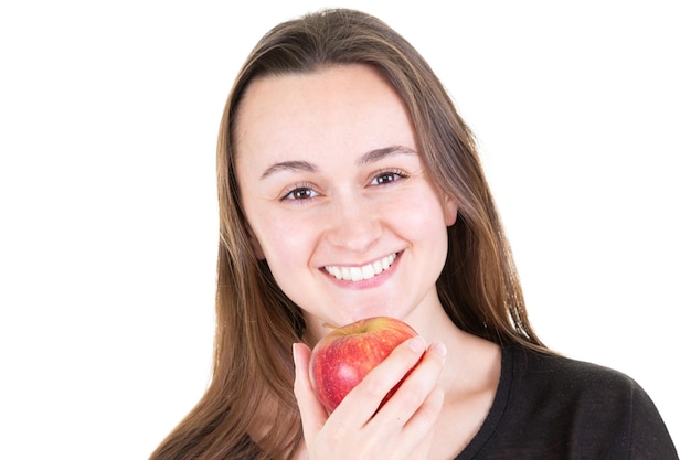 Happy girl with large smile holding red apple