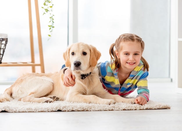 Happy girl with retriever