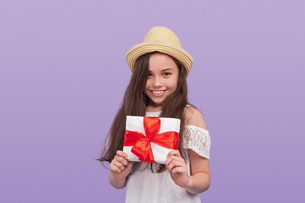 Happy girl with wrapped gift