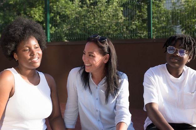 Photo happy girls of different nationalities in the summer.