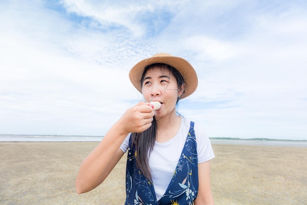 Happy girls enjoy ice cream and summer vacations