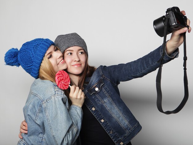 Happy girls friends taking some pictures