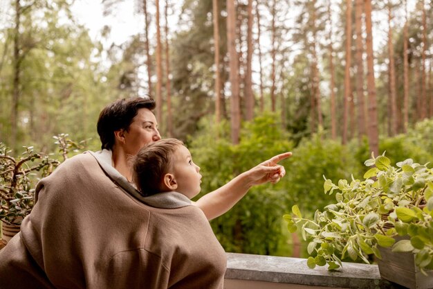 Photo happy grandmother and grandson enjoy time together positive middle age woman