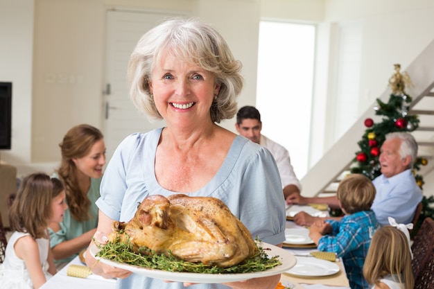 Happy grandmother with Christmas meal