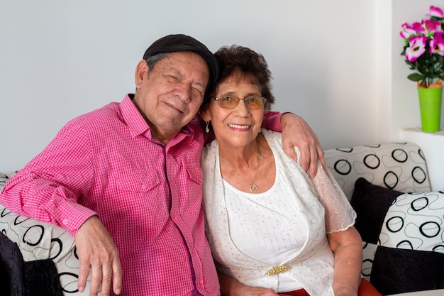 Photo happy grandparents couple hugging each other enjoying their retirement elderly latin couple