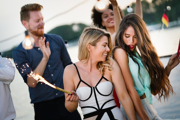 Happy group of friends having party and fun together outdoor