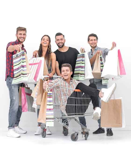 Happy group of young people with shopping bags