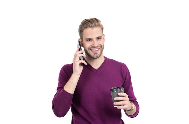 Photo happy guy hold takeaway coffee cup talking on smrtphone isolated on white mobile