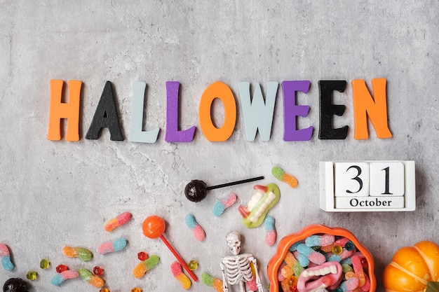 Happy Halloween day with ghost candies pumpkin bowl and decorative Trick or Threat Hello October fall autumn Festive party and holiday concept