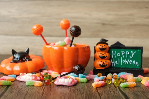 Happy Halloween day with ghost candies pumpkin bowl Jack O lantern and decorative selective focus Trick or Threat Hello October fall autumn Festive party and holiday concept