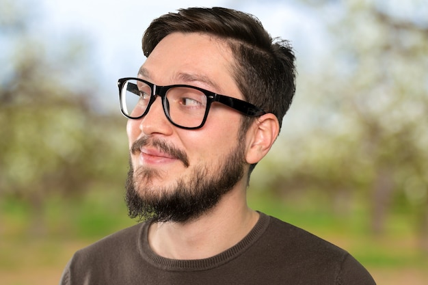 Happy handsome bearded man in casual clothes