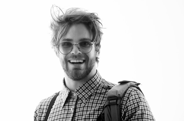 Happy handsome man smiling in nerd glasses