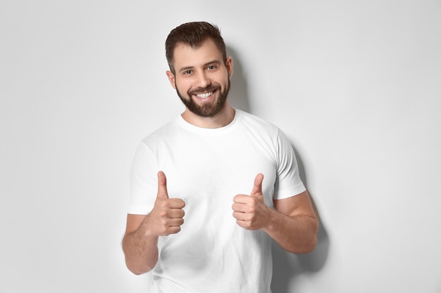 Happy handsome man with thumbs up